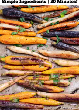 Pinterest pin with a sheet pan lined with parchment paper with roasted and caramelized rainbow carrots in a single layer, with sprigs of fresh thyme, after being roasted.