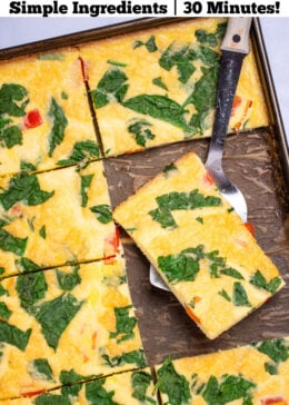 Pinterest pin with a sheet pan with fully cooked eggs with spinach and bell pepper, cut into pieces, with a spatula holding a piece and resting on the sheet pan.
