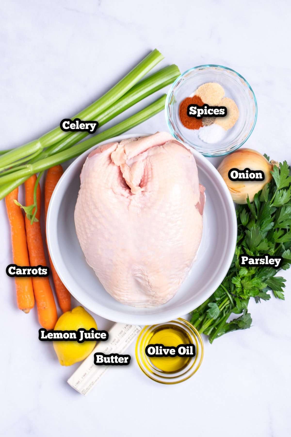 Individual ingredients for slow cooker turkey breast on a table.