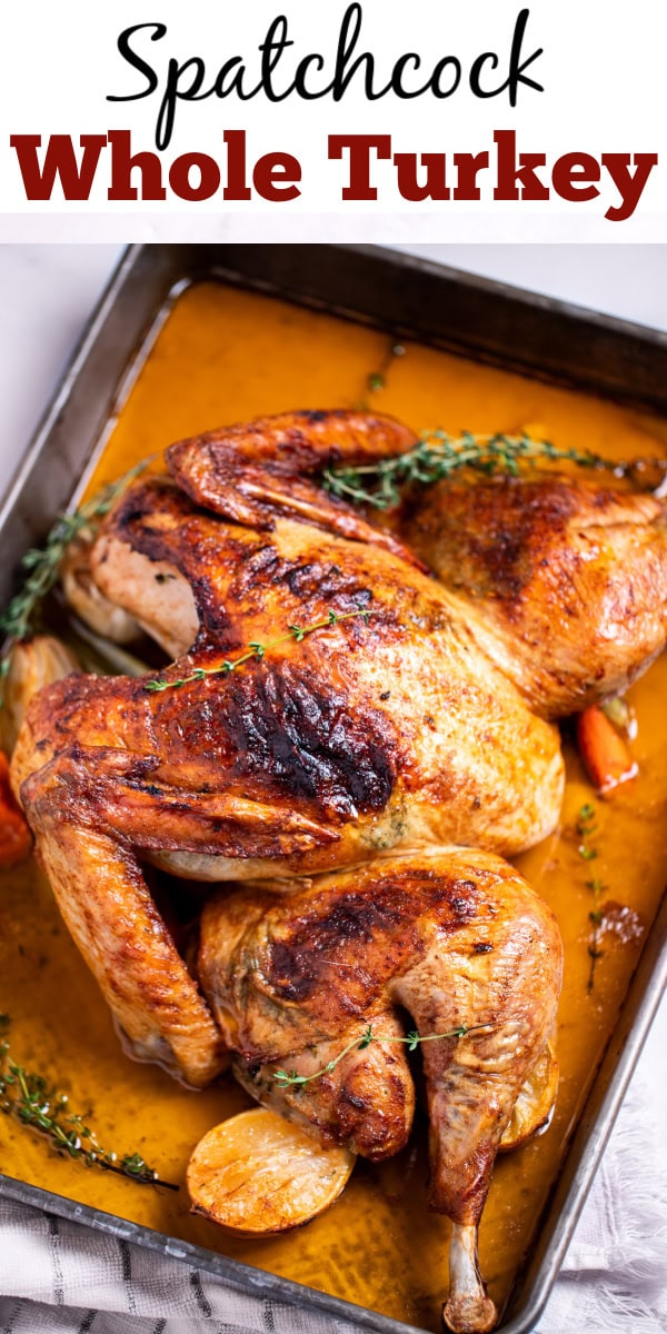 Pinterest pin with a roasting pan with a golden brown spatchcocked turkey resting on top of lemon and vegetables, with melted butter and fresh thyme on the bottom of the pan, and a kitchen towel on the table next to the roasting pan.