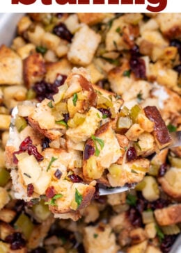 Pinterest pin with a spatula lifting gluten free stuffing out of a baking dish.