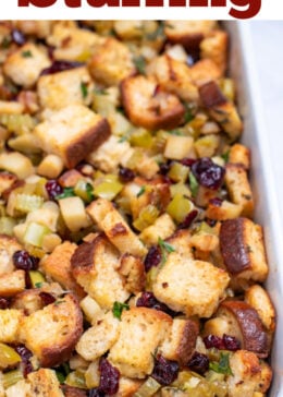 Pinterest pin with a baking dish full of gluten free stuffing on a table.