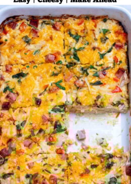 Pinterest pin with a casserole dish with hashbrown breakfast casserole topped with melted cheese and fresh parsley, with a piece missing.