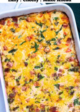 Pinterest pin with a casserole dish with hashbrown breakfast casserole topped with melted cheese and fresh parsley.