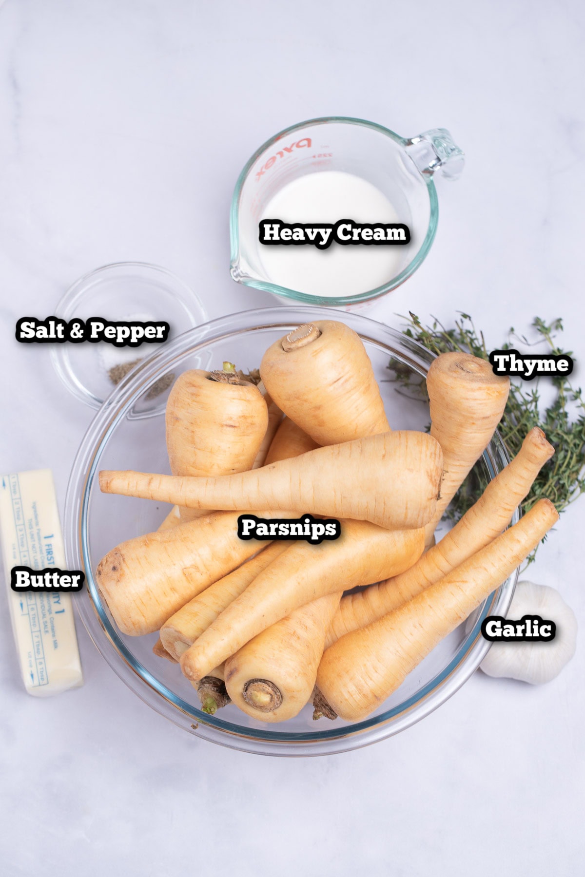 Individual ingredients for parsnip puree on a table.