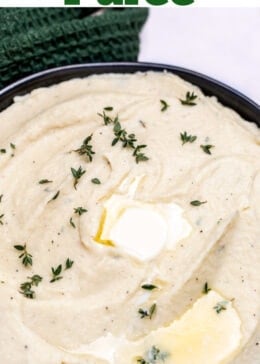 Pinterest pin with a bowl of parsnip puree topped with butter and thyme, next to fresh thyme on a table.