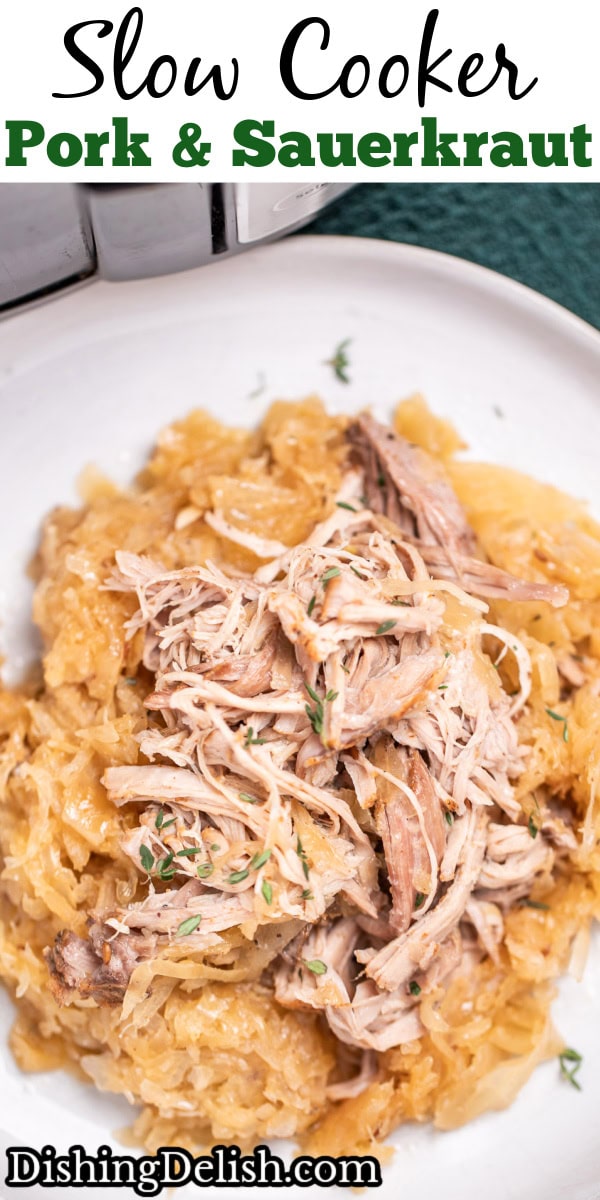 Pinterest pin with a plate with shredded pork shoulder over sauerkraut, in front of a slow cooker.