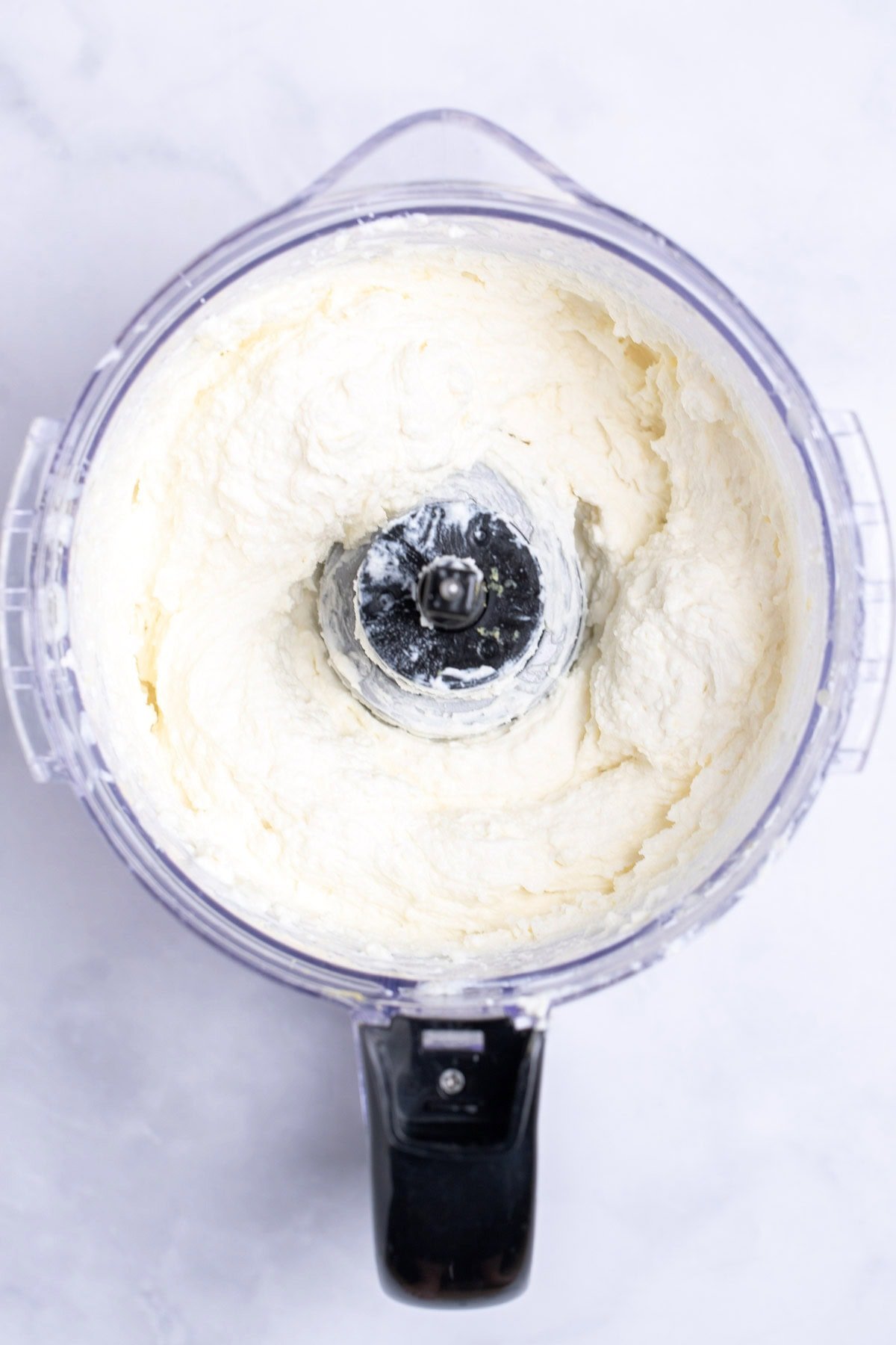 Feta dip in a food processor right after being pureed.