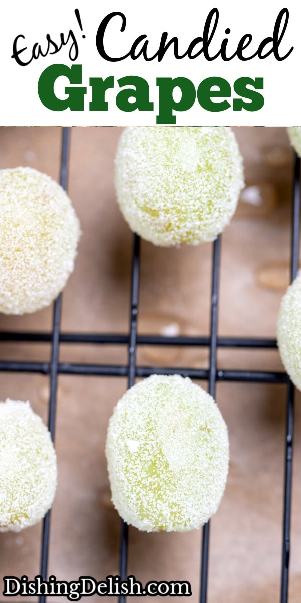 Pinterest pin with a sheet pan lined with parchment paper and a rack, with grapes rolled in sugar on top.