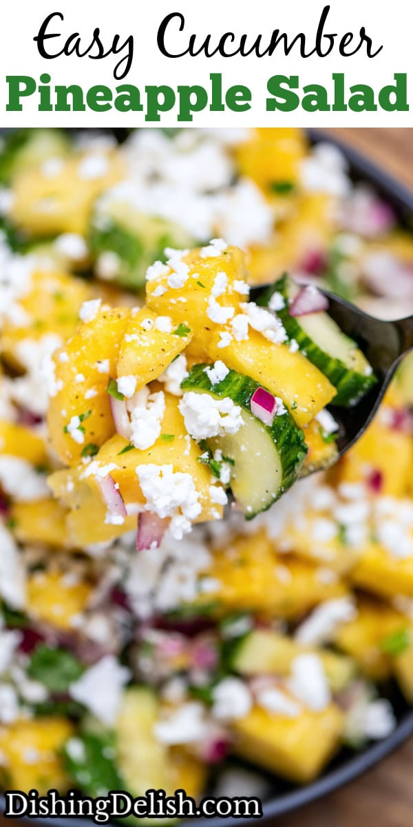 Pinterest pin with a bowl of pineapple cucumber salad topped with feta cheese with a spoon lifting some up.