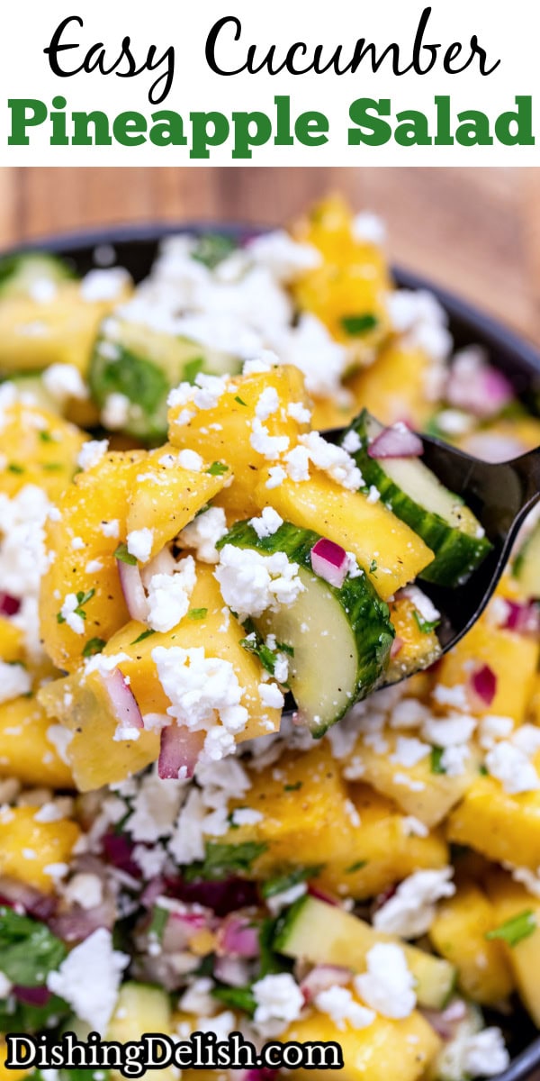 Pinterest pin with a bowl of pineapple cucumber salad topped with feta cheese with a spoon lifting some up.