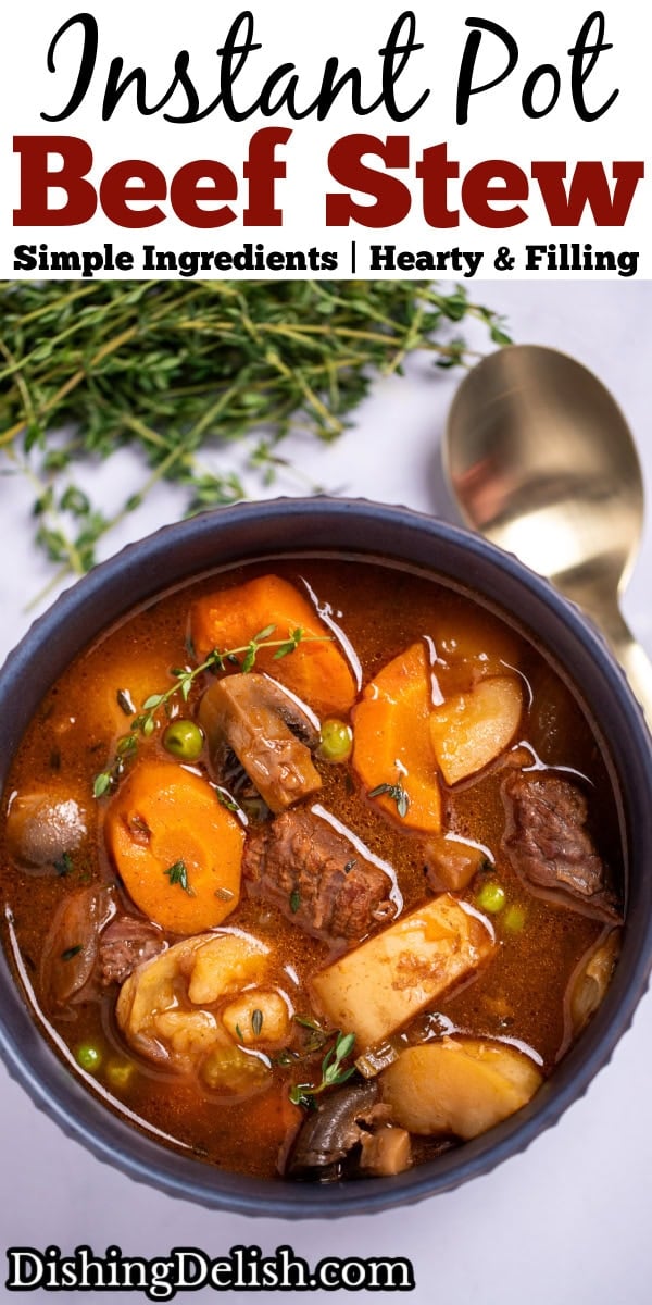 Pinterest pin with a bowl of beef stew with potatoes, carrots, peas, beef, and mushrooms in a tomato based broth topped with fresh thyme, with a spoon and fresh herbs in the background.