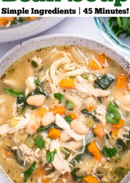 Pinterest pin with a bowl of white bean chicken soup with a pot of soup in the top left of the photo, and a small glass bowl of chopped parsley on the top right.