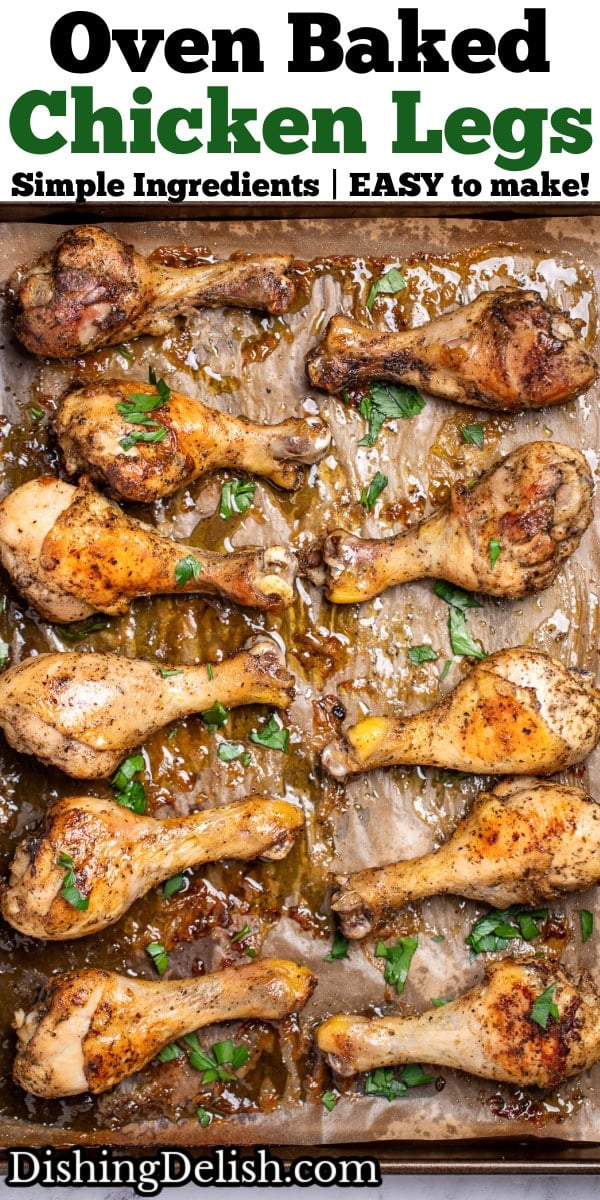 Pinterest pin with a sheet pan lined with parchment paper, with baked chicken legs in two rows on the pan, topped with fresh parsley.