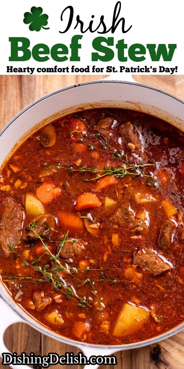 Pinterest pin with a dutch oven on a cutting board full of Irish beef stew topped with fresh thyme.