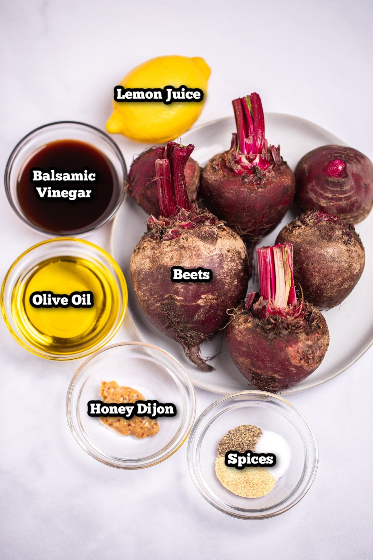 Individual ingredients for roasted beet salad on a table.