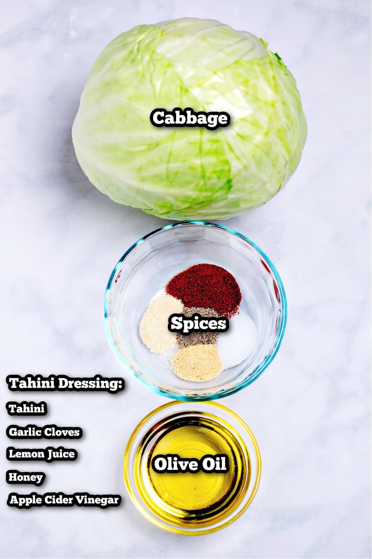 Individual ingredients for roasted cabbage steaks on a table.