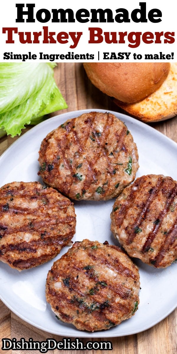 Pinterest pin with four turkey burgers with grill marks on a plate resting on a wooden cutting board, next to lettuce and a hamburger bun.