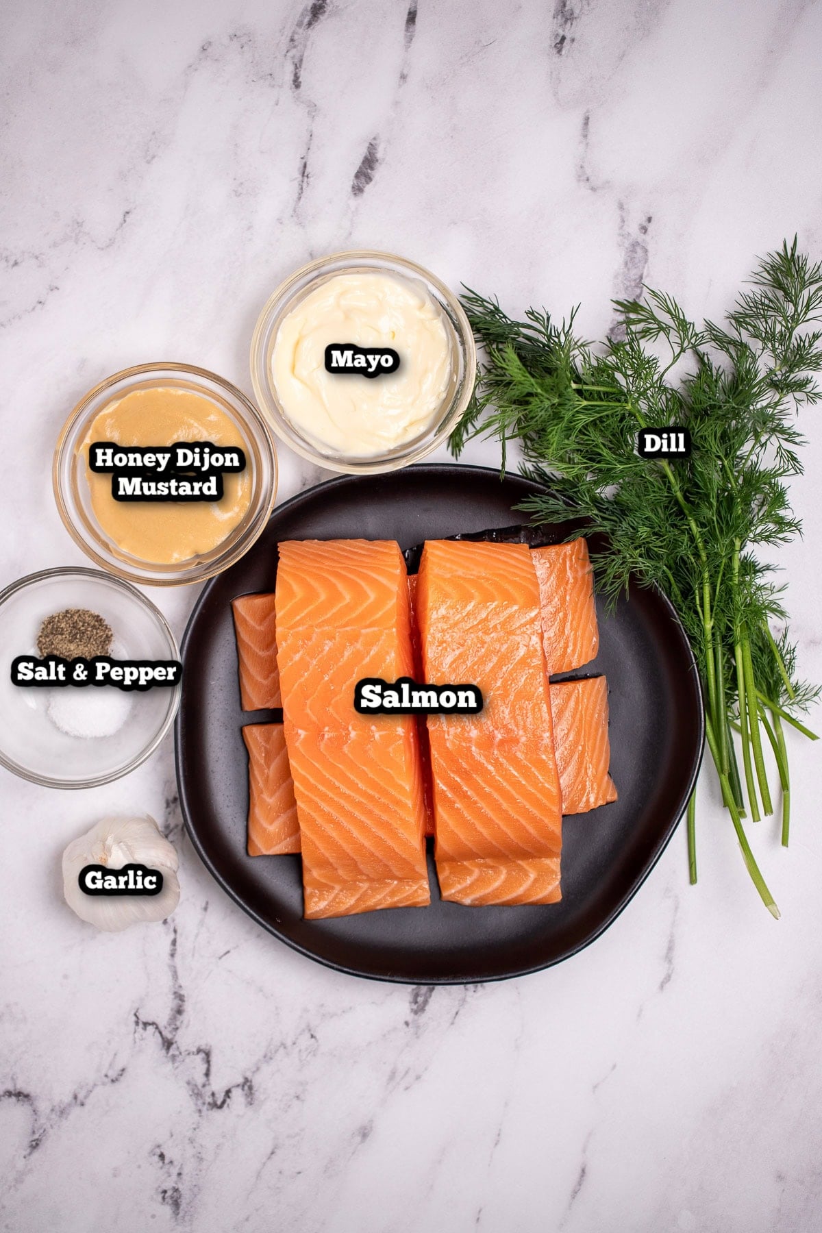 Individual ingredients for honey dijon salmon on a table.