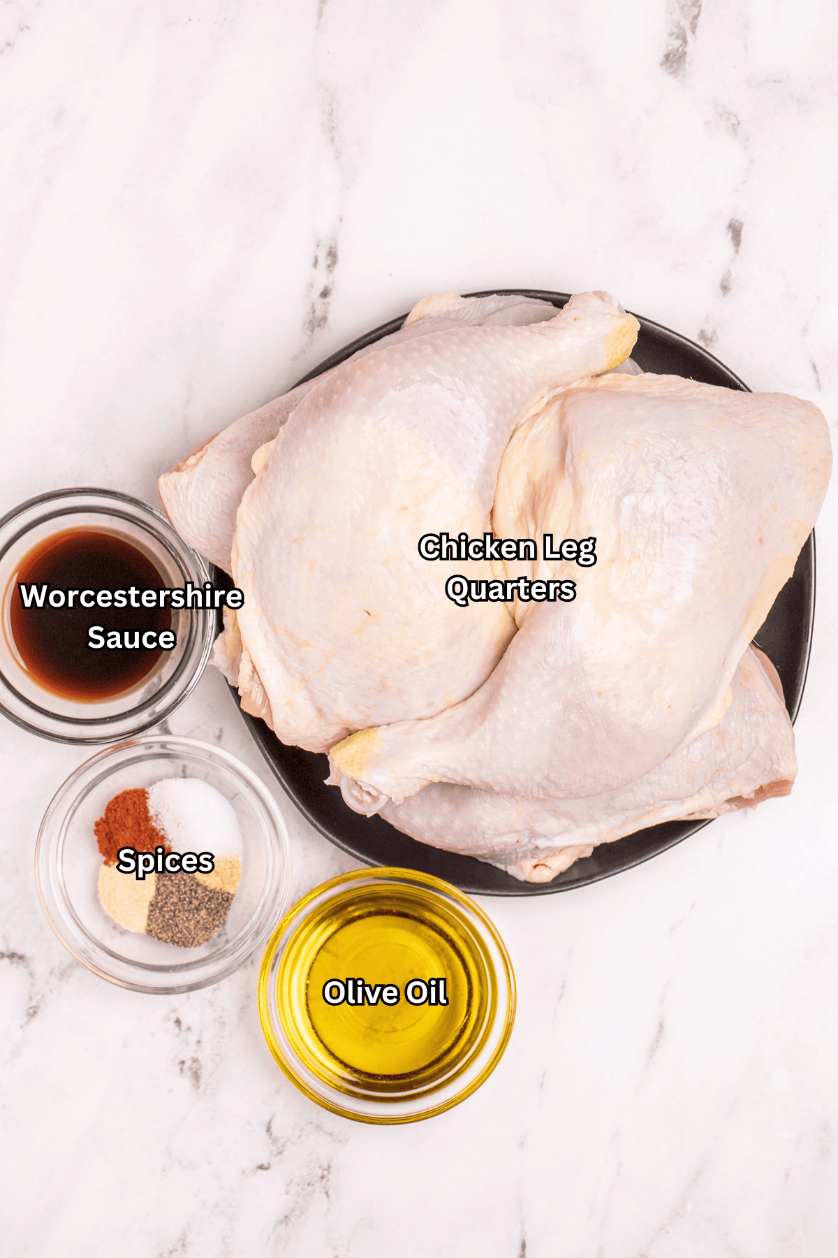 Individual ingredients for baked chicken quarters on a table.