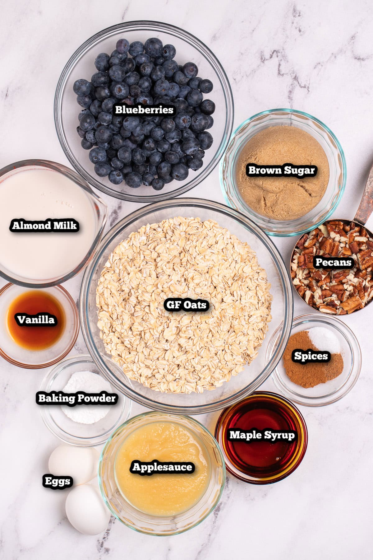 Individual ingredients for blueberry baked oatmeal on a table.