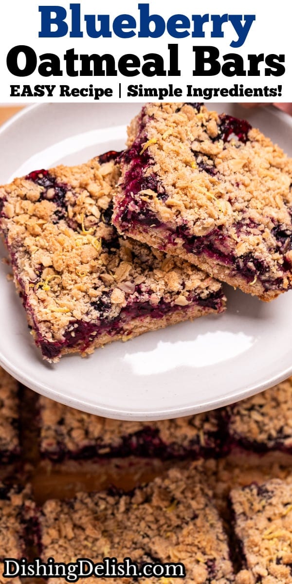 Pinterest pin with two hands holding a plate with two blueberry oatmeal bars on it, above a pan of more bars.