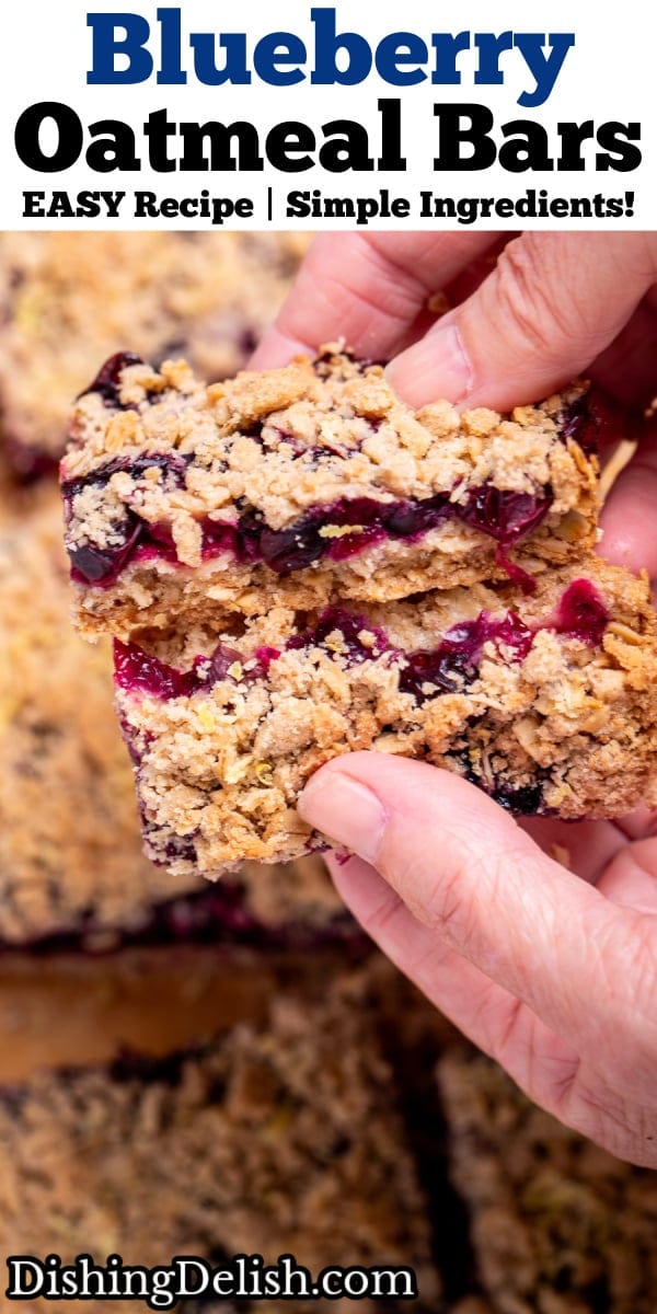 Pinterest pin with two hands breaking a blueberry oatmeal bar in half to show the middle blueberry layer, above more bars.