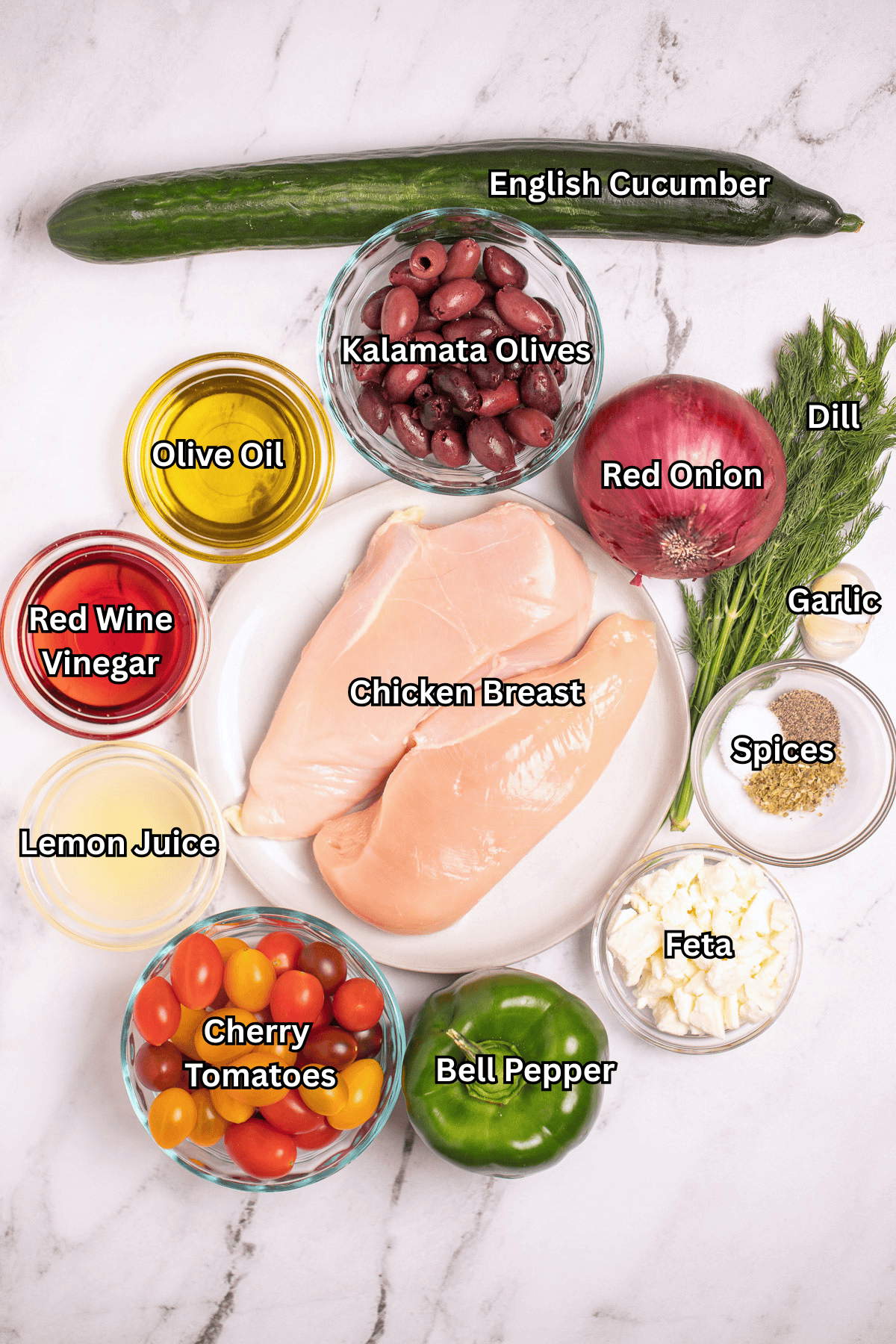 Greek chicken bowl ingredients on a table.