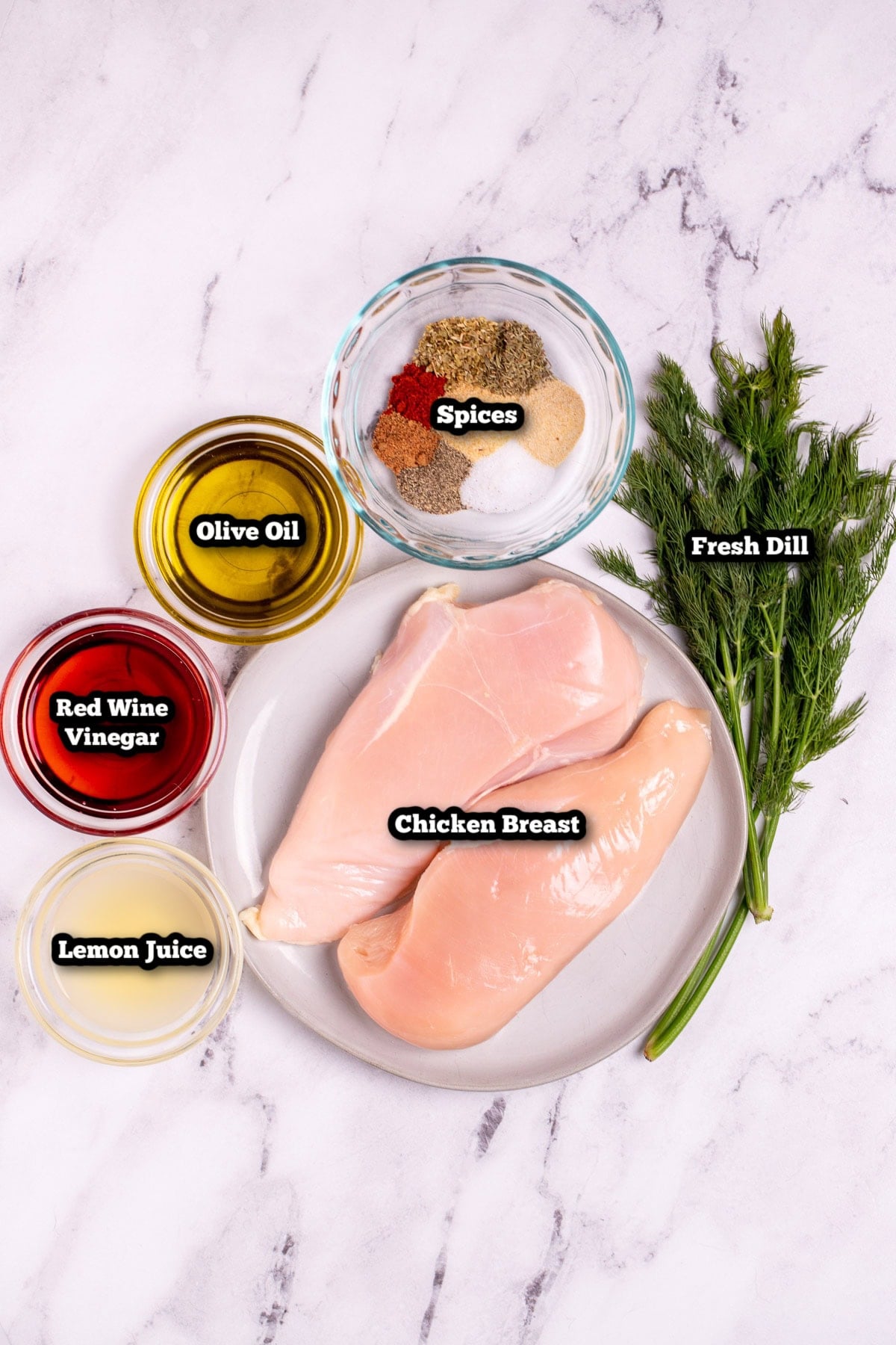 Individual ingredients for Greek Chicken Marinade on a table.