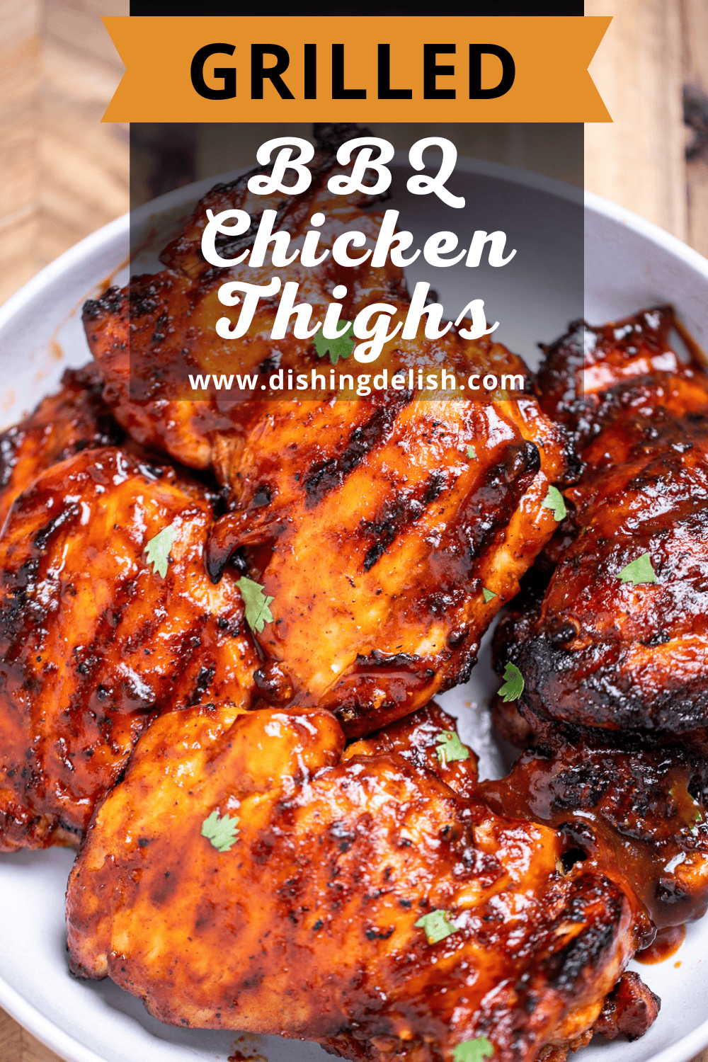 Pinterest pin with a bowl of BBQ chicken thighs, sitting on a cutting board.
