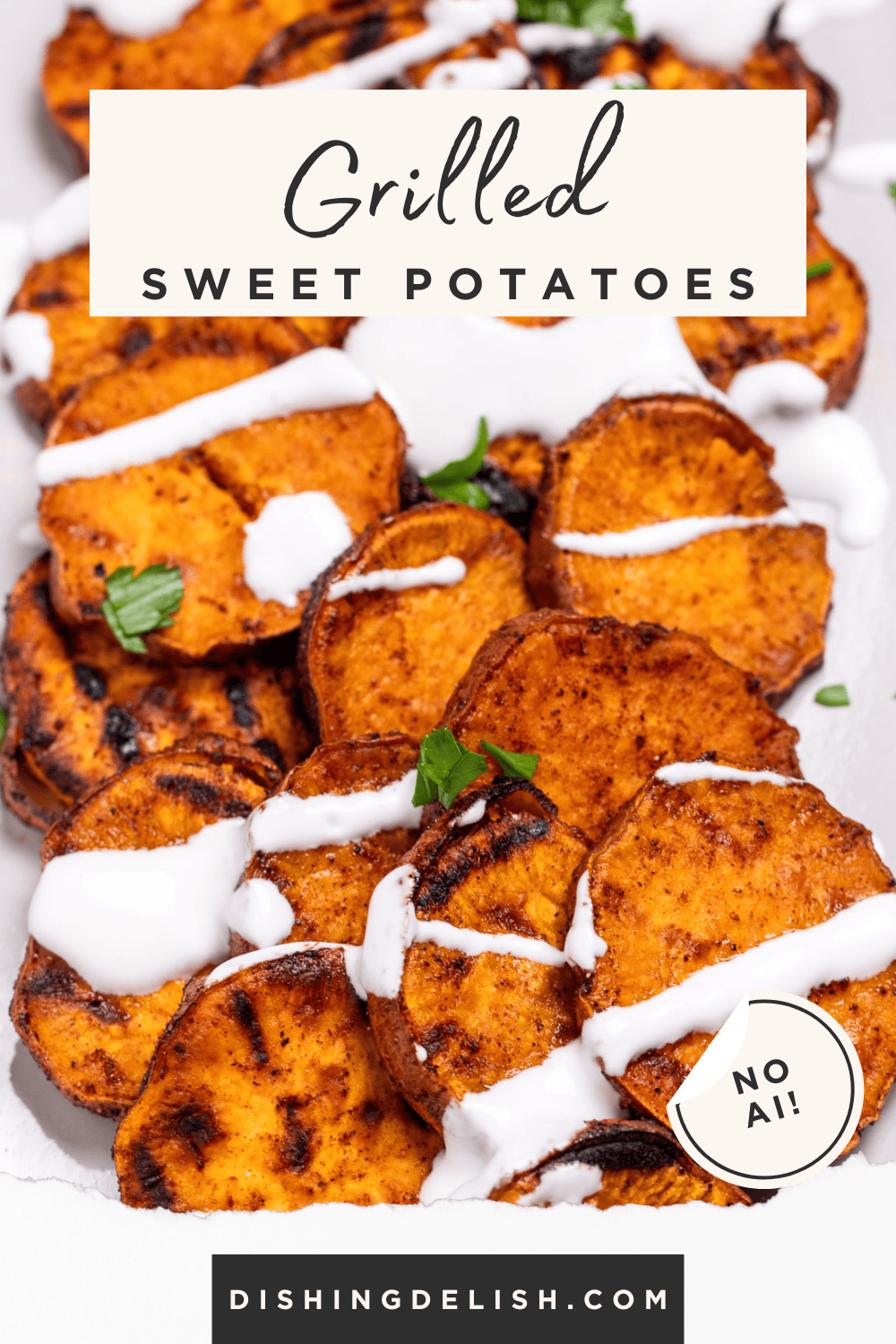 Pinterest pin with a plate of grilled sweet potatoes topped with drizzled sour cream and chopped fresh parsley.