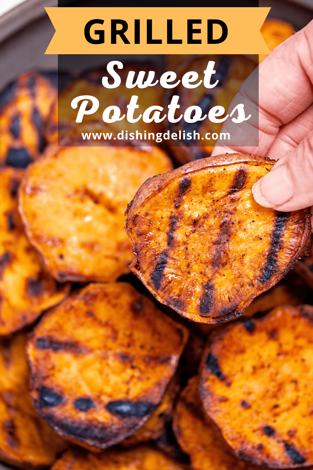 Pinterest pin with a plate of grilled sweet potatoes on a table, with a hand lifting one up.