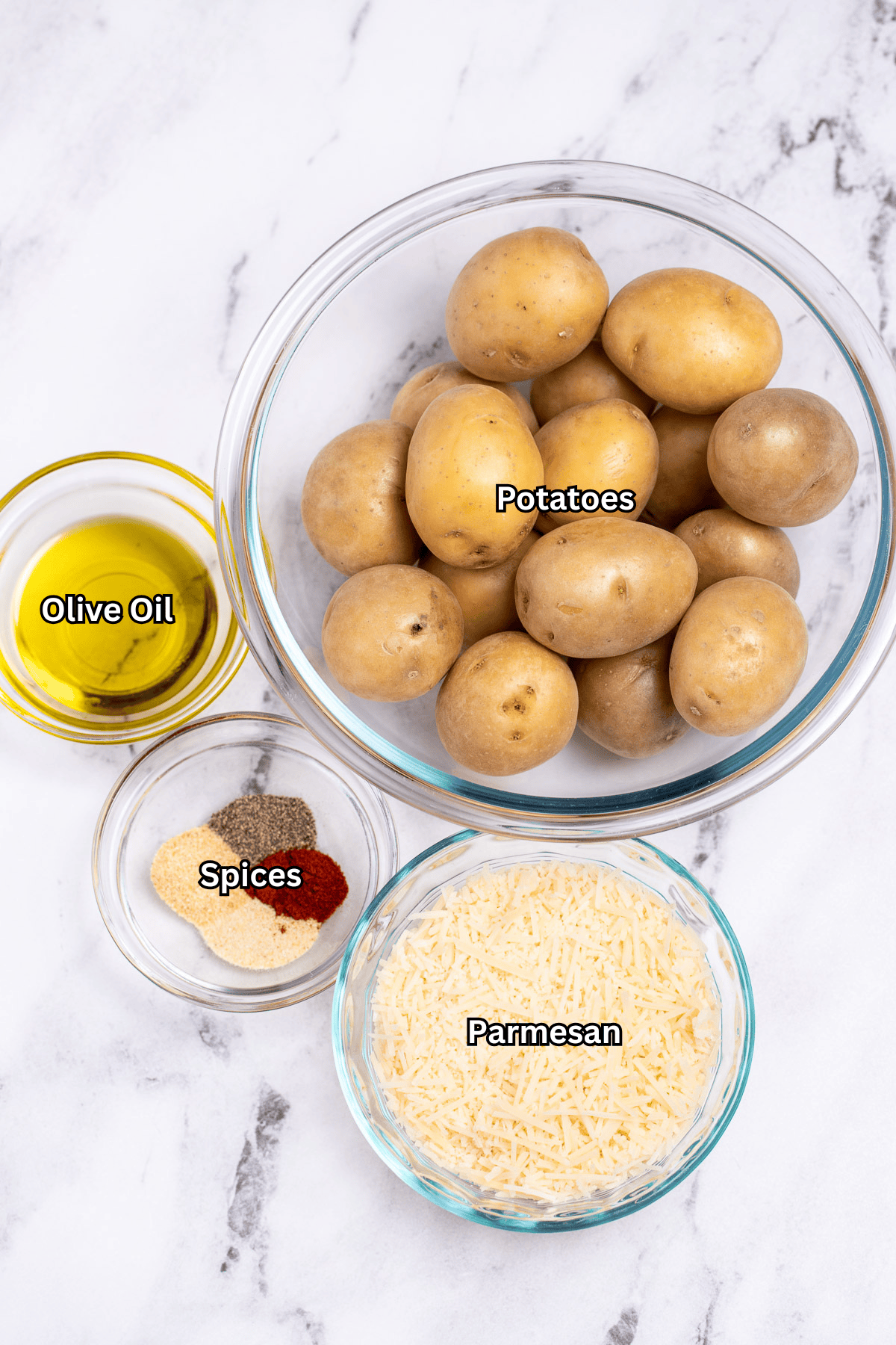Individual ingredients for Garlic Parmesan Smashed Potatoes on a table.