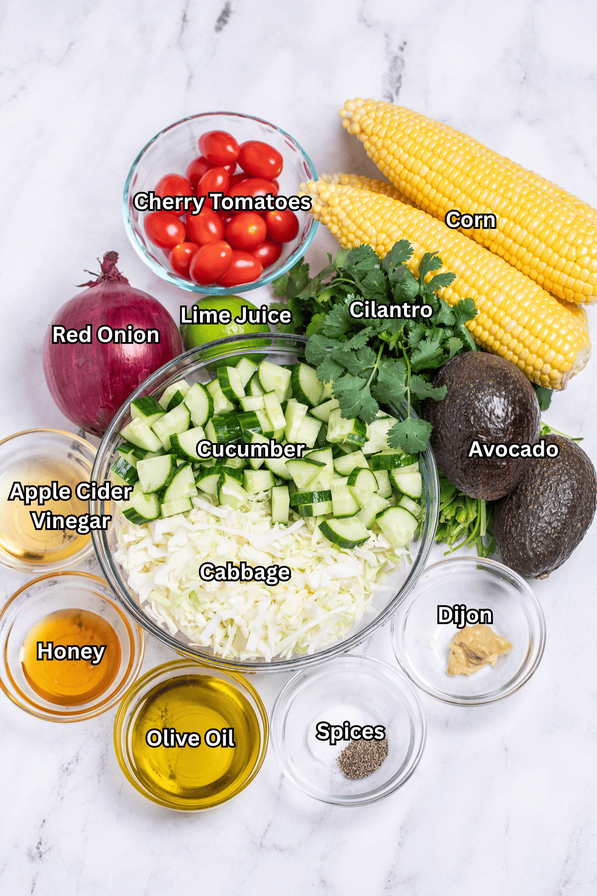 Individual ingredients for grilled corn salad on a table.