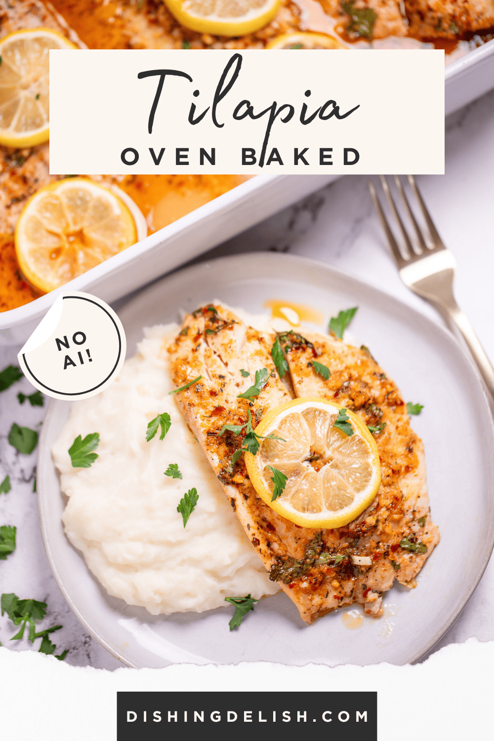 Pinterest pin with a tilapia fillet with a lemon slice on top of mashed potatoes on a plate, on a table in front of a baking dish with more tilapia in it.