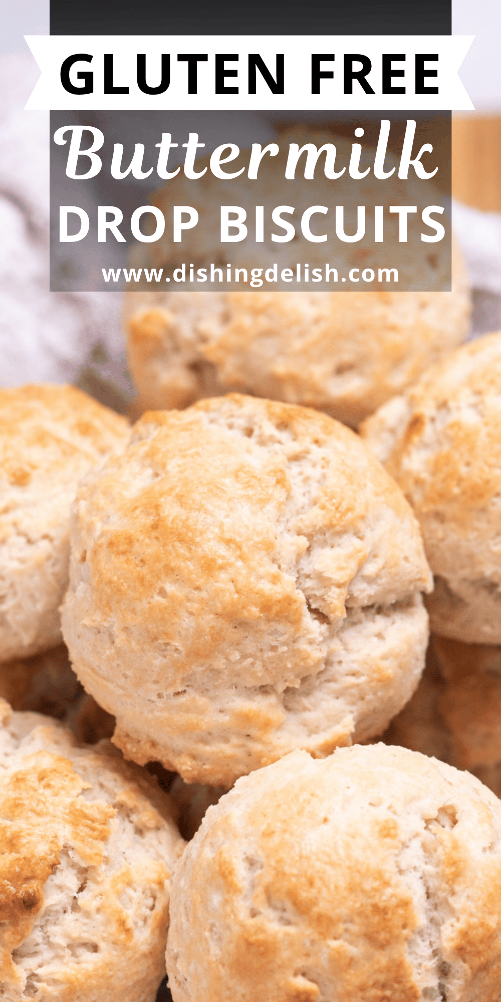 Pinterest pin with a basket with a tea towel full of gluten free drop biscuits resting on top of each other.