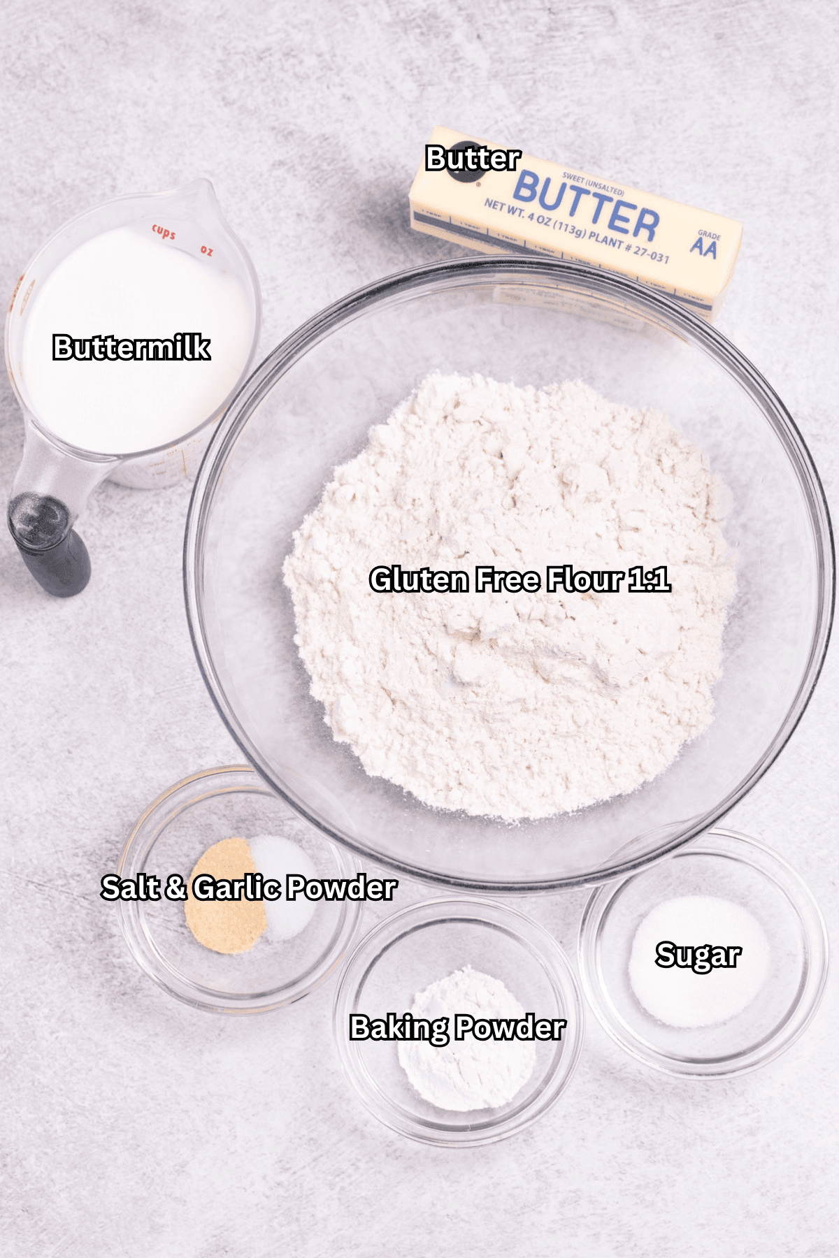 Individual ingredients for gluten free buttermilk drop biscuits on a table.