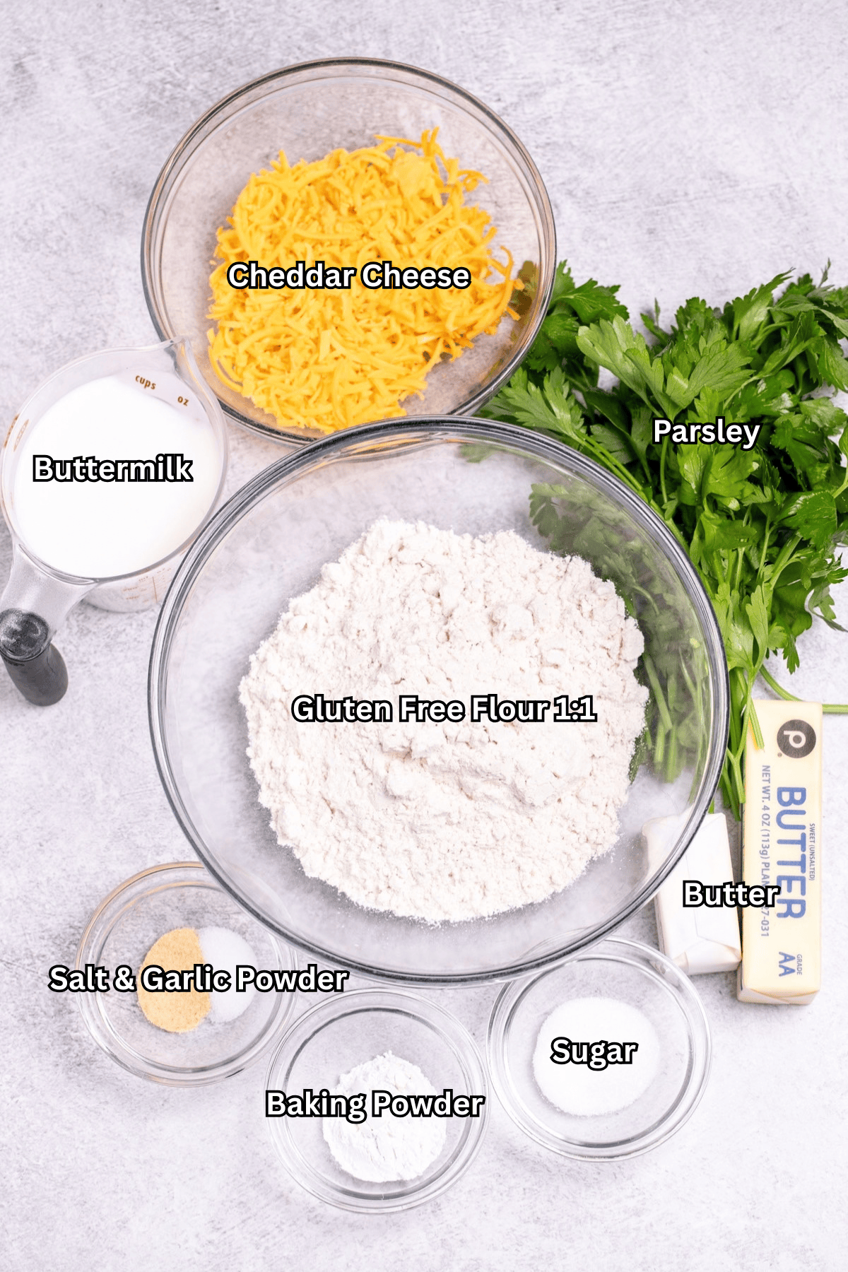 Individual ingredients for gluten free Red Lobster cheddar bay biscuits on a table.