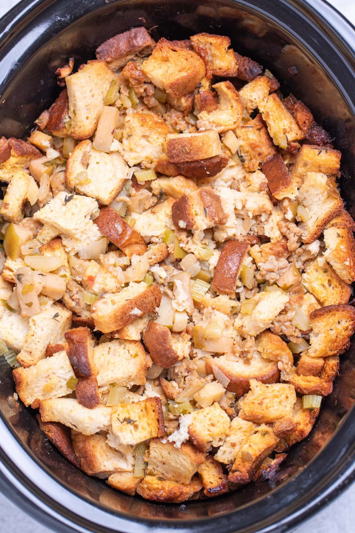 A slow cooker full of gluten free sausage stuffing.